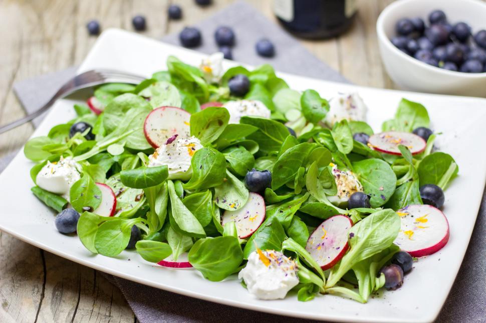 Free Image of A plate of salad with blueberries and radishes 