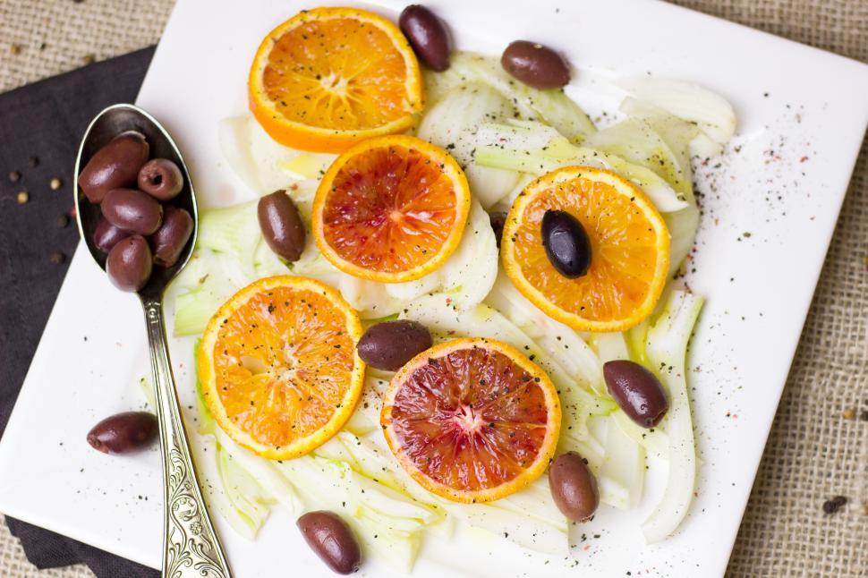 Free Image of A plate of food with oranges and olives 