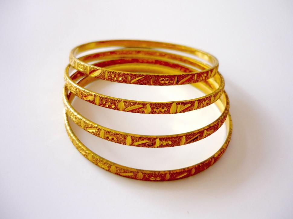 Free Image of Stack of Bangles on White Surface 