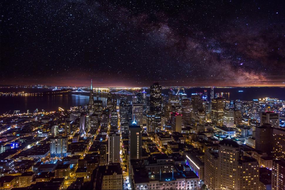Free Image of A city at night with stars in the sky 