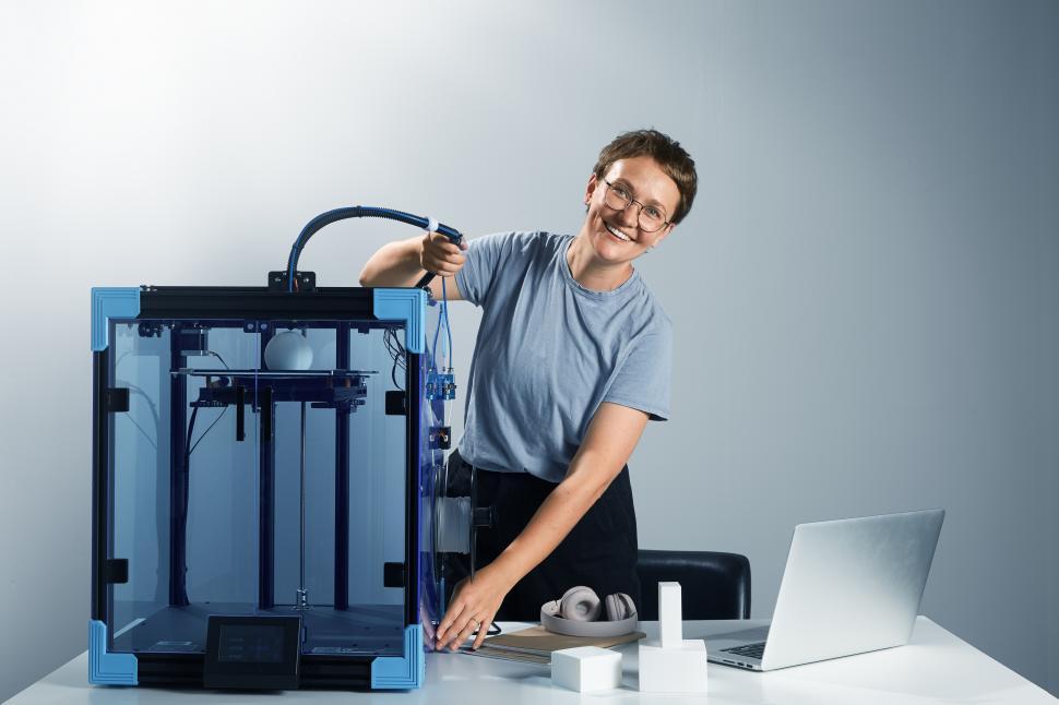 Free Image of happy woman with 3 d printer 