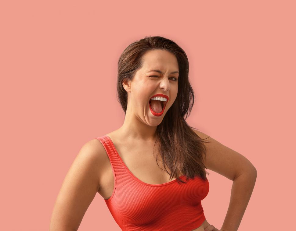 Free Image of smiling woman gives a big wink 