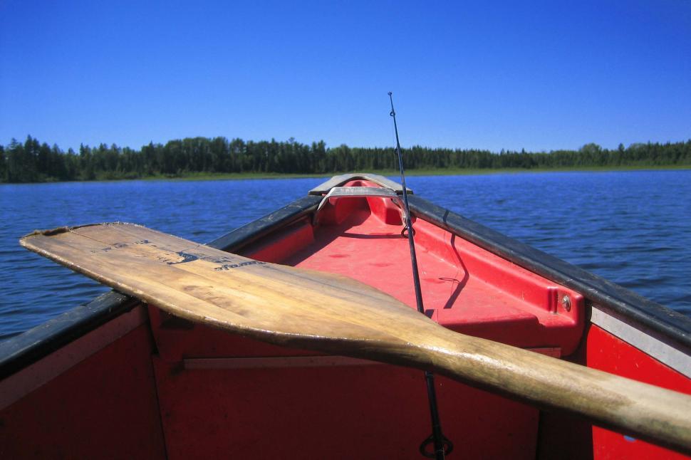 Free Image of Red Boat and Wooden Paddle on Lake 