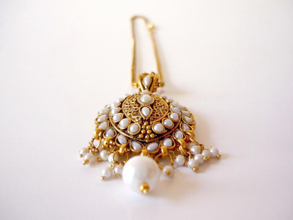 Free Image of Close Up of Elegant Earrings Sparkling in the Light 