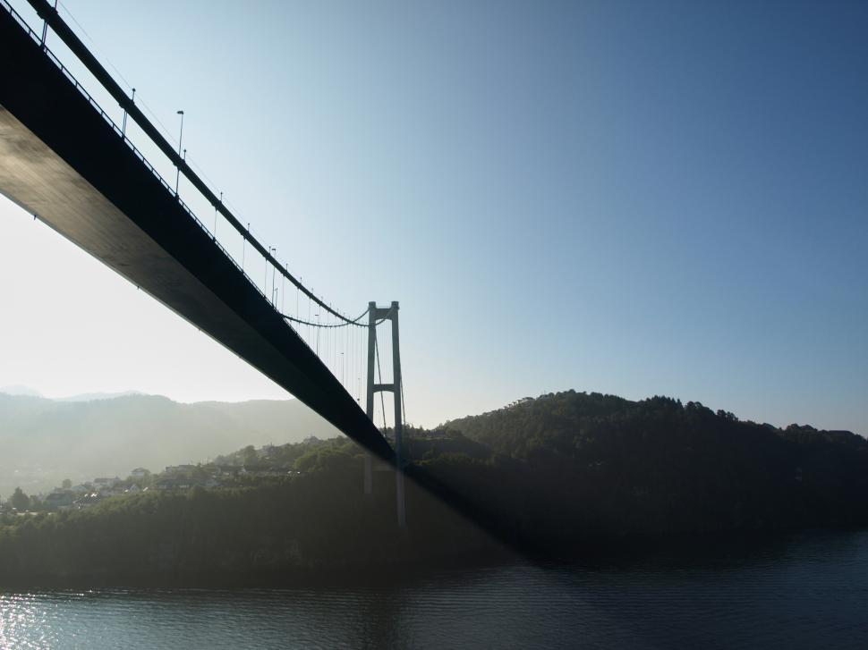 Free Image of A bridge over water with a city in the background 