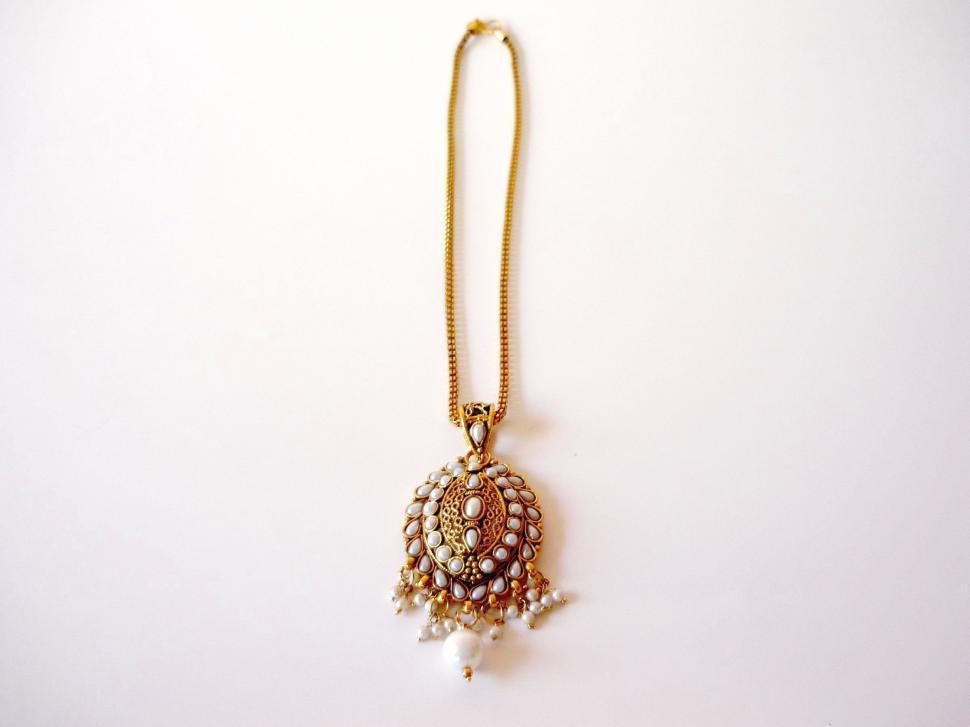 Free Image of Gold Necklace With Beaded Ball Pendant 