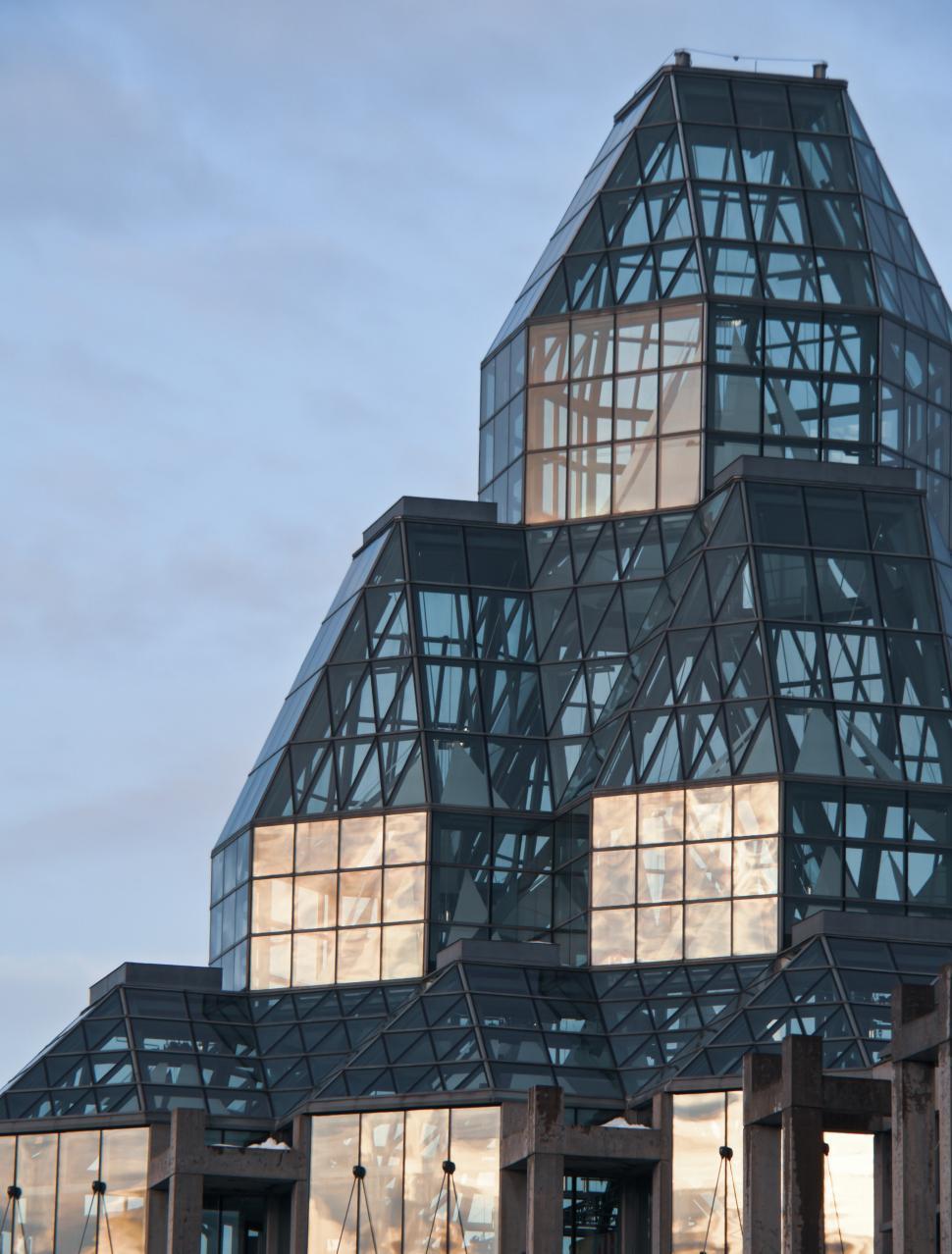 Free Image of A glass building with a triangular roof 