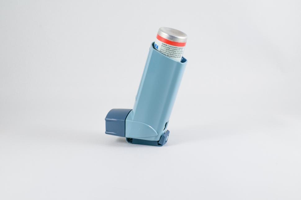 Free Image of A blue inhaler with a silver tube 
