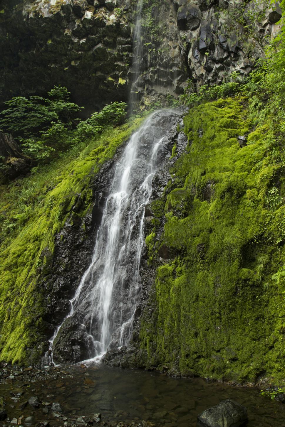 Free Image of A waterfall on a rocky cliff 