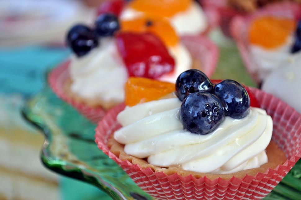 Free Image of A cupcakes with fruit on top 