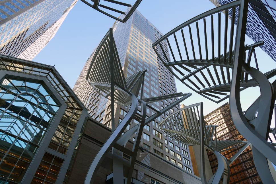 Free Image of A tall buildings with a metal sculpture 