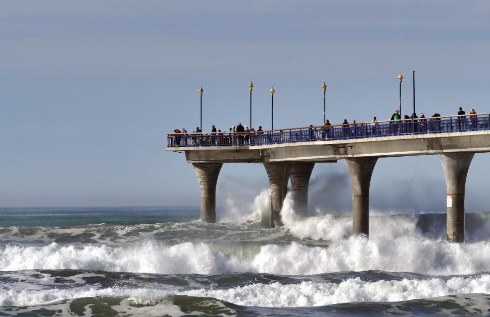 Free Image of A pier with people on it 