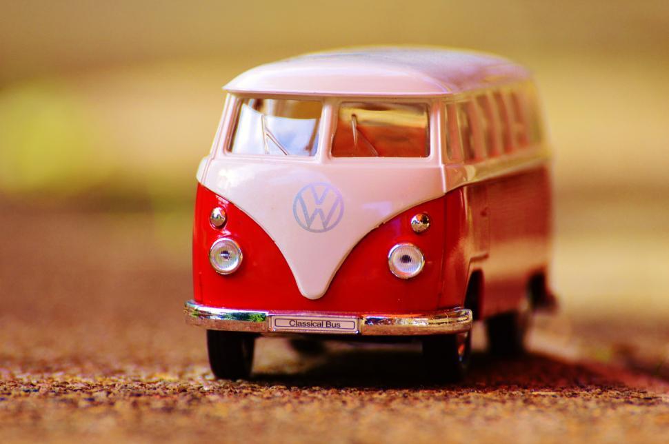 Free Image of A red and white toy bus 
