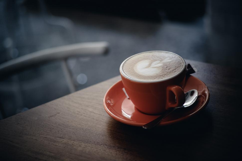 Free Image of A cup of coffee on a saucer with a spoon 