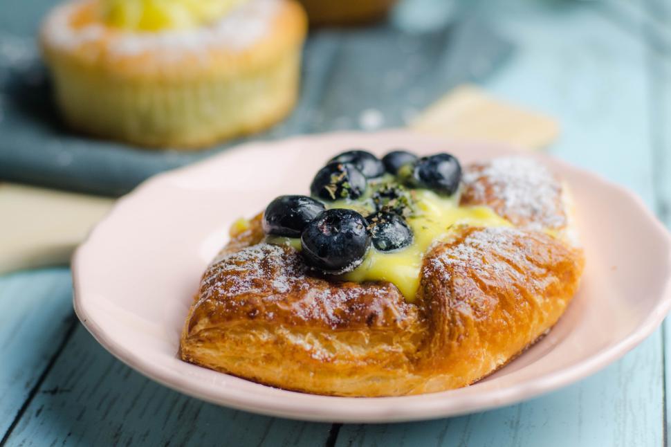 Free Image of A pastry with blueberries and custard on top 