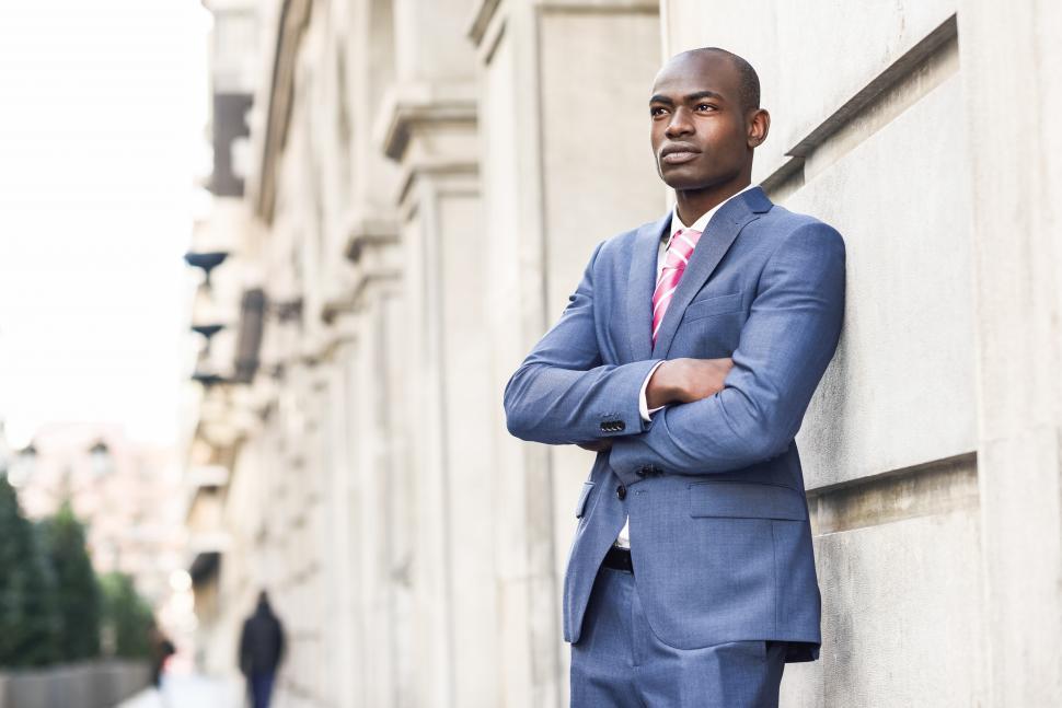 Free Image of Handsome black man wearing suit in urban background 