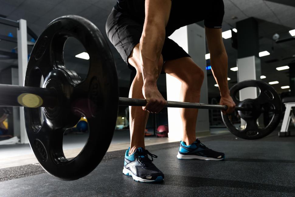 Free Image of Closeup of weightlift workout at the gym with barbell. 