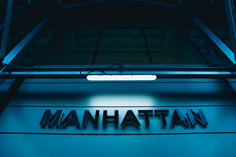 Free Image of A sign on a building says Manhattan 