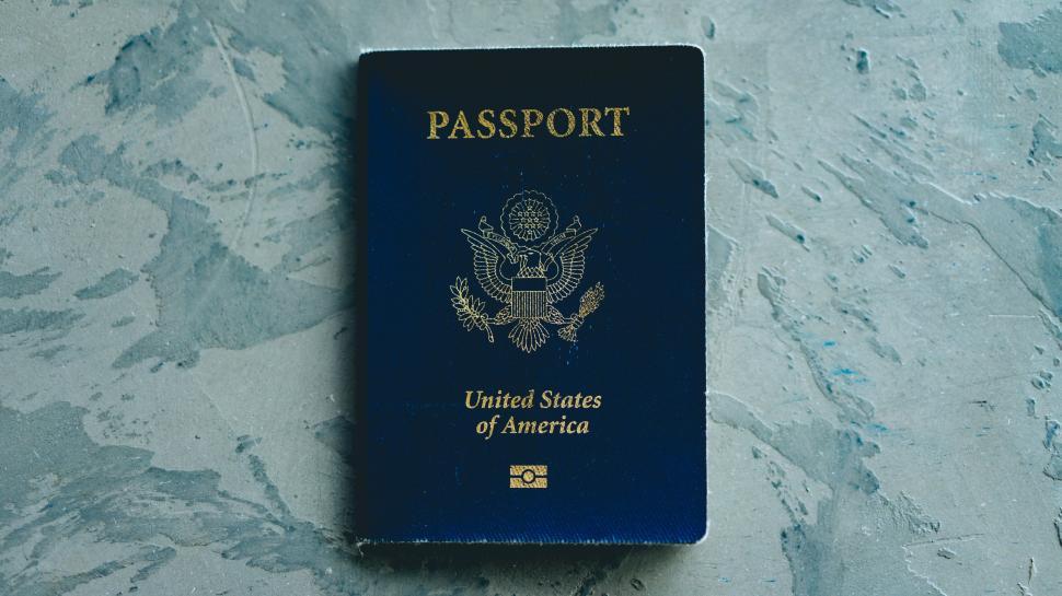 Free Image of A blue passport with gold text on it 