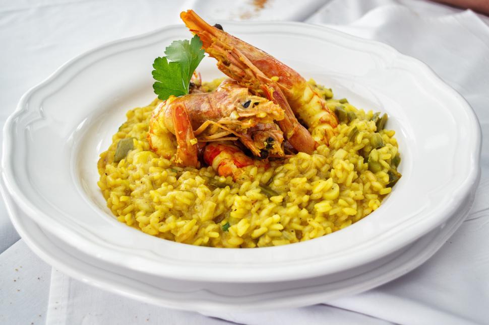 Free Image of A plate of rice with shrimp and vegetables 