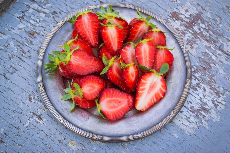 Free Image of A plate of cut strawberries 