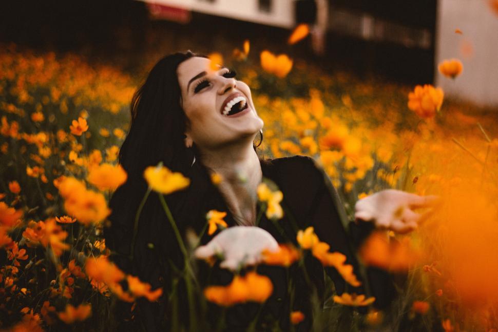 Free Image of A woman in a field of flowers 
