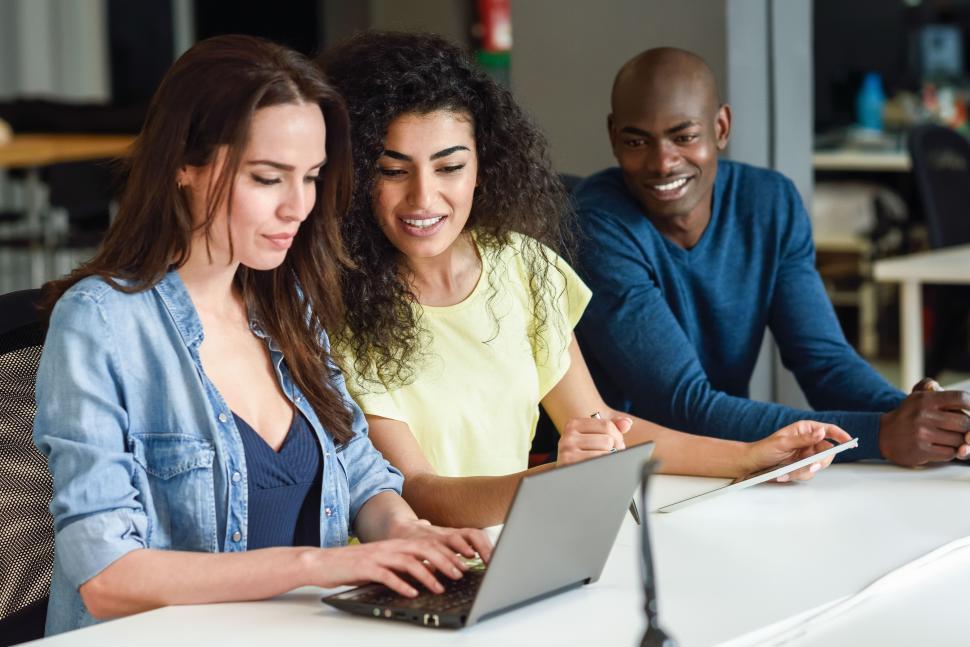 Free Image of Multi-ethnic group of young people studying with laptop computer 