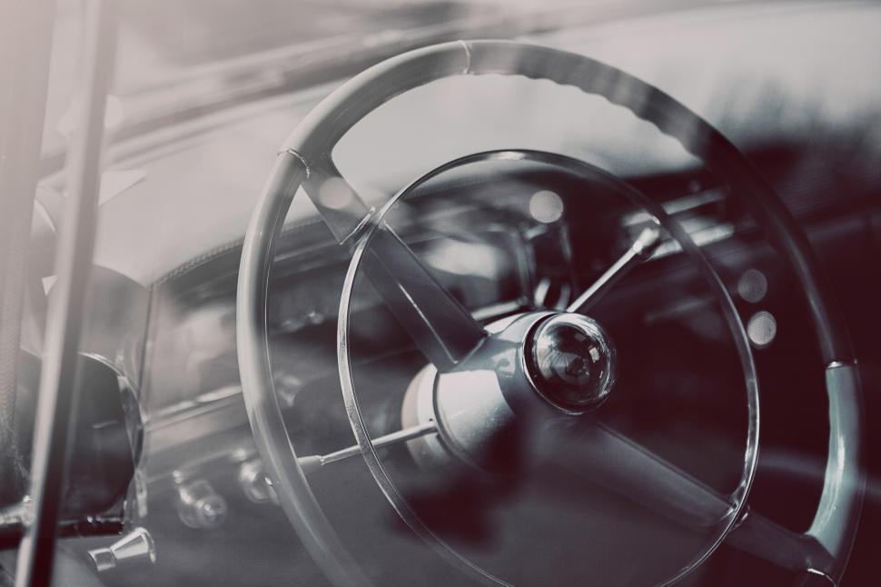 Free Image of A steering wheel and dashboard of a car 