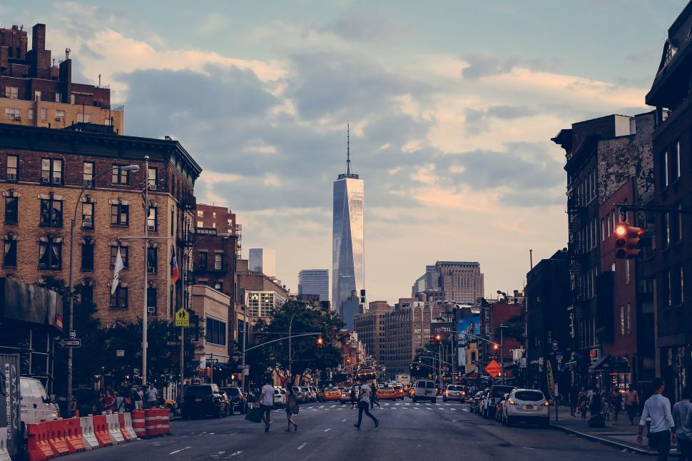 Free Image of A New York City street with a tall building in the distance 