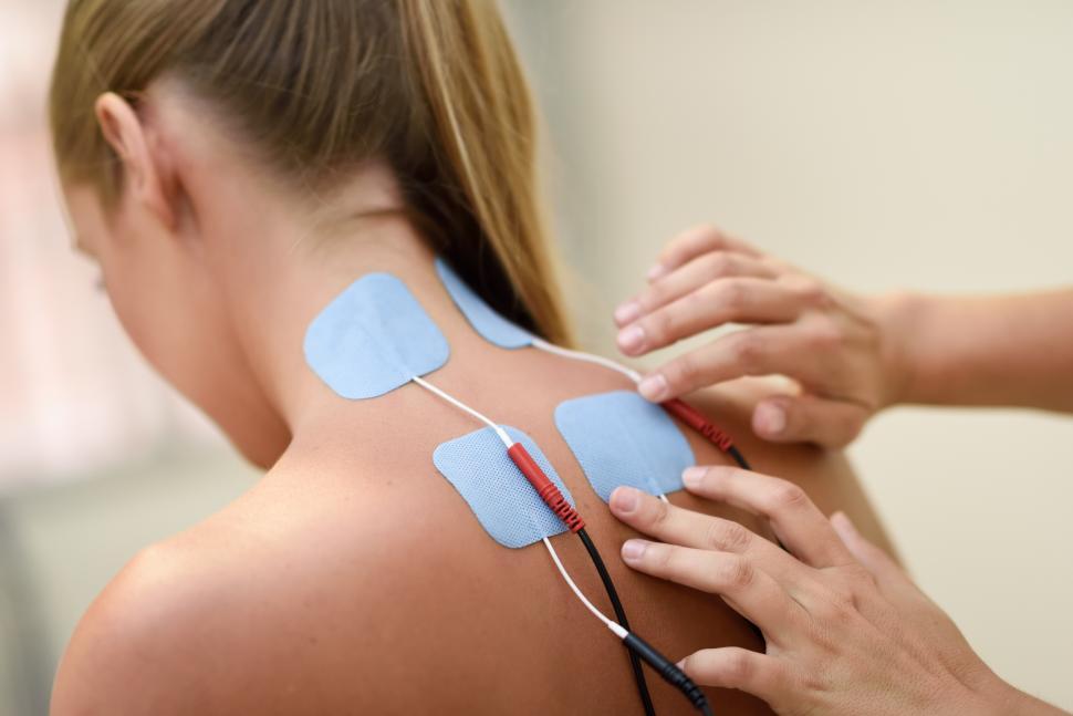 Free Image of Electro stimulation in physical therapy to a young woman 