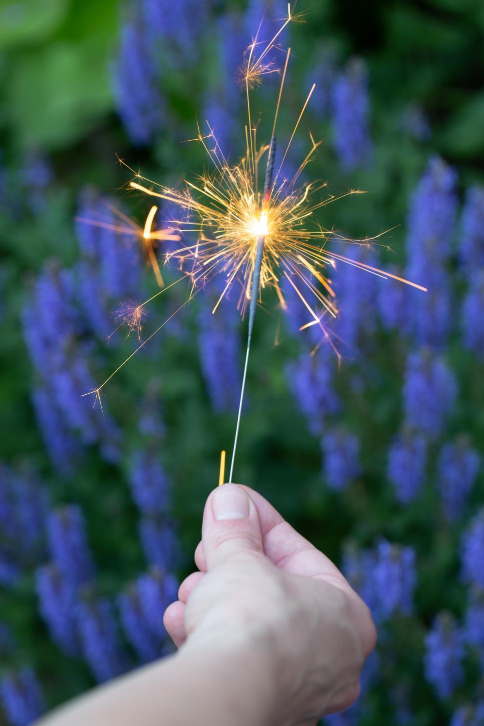 Free Image of A hand holding a sparkler 