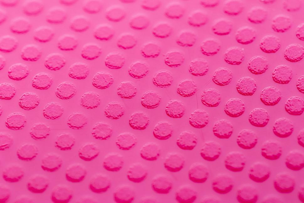 Free Image of A close up of a pink surface 