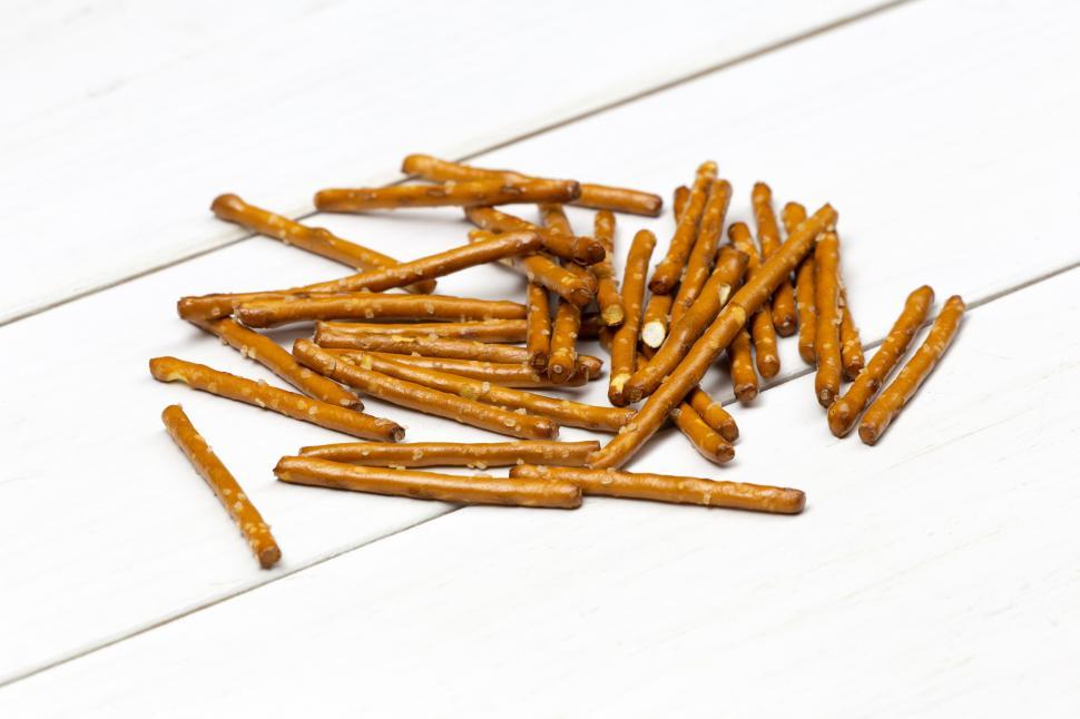 Free Image of A pile of pretzels on a white surface 