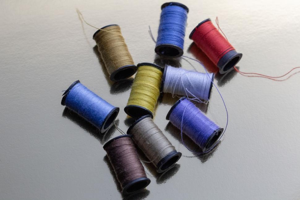 Free Image of A group of spools of thread 