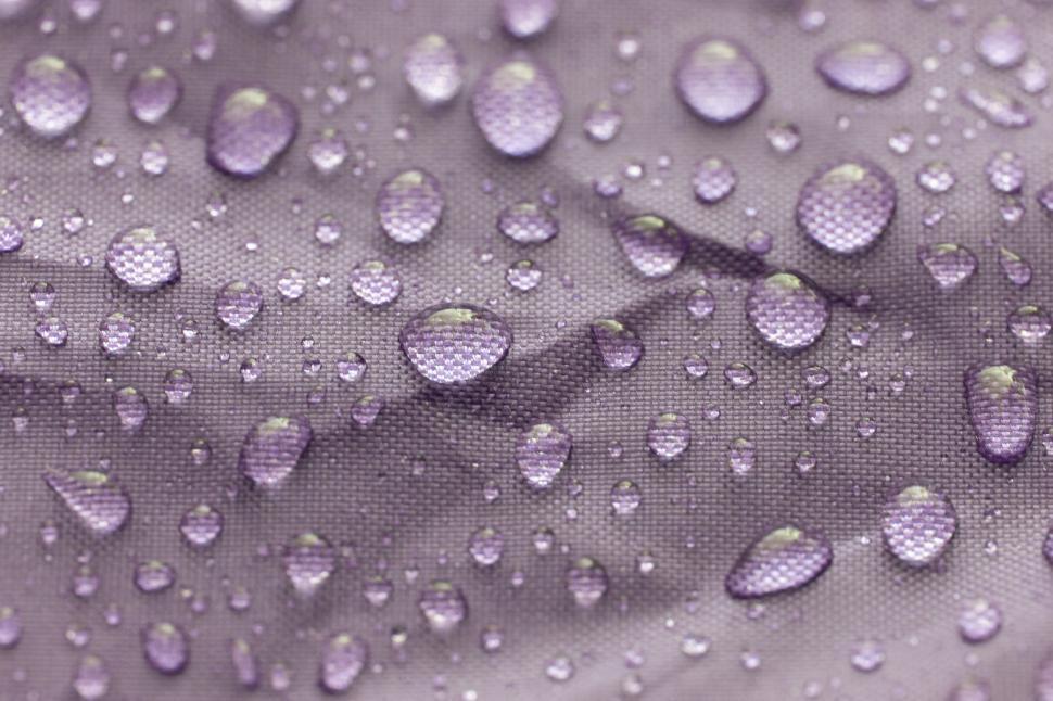 Free Image of Water droplets on a fabric surface 