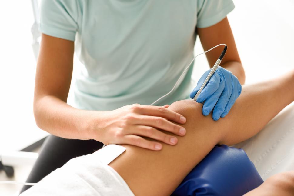 Free Image of Electroacupuncture dry with needle on female knee 