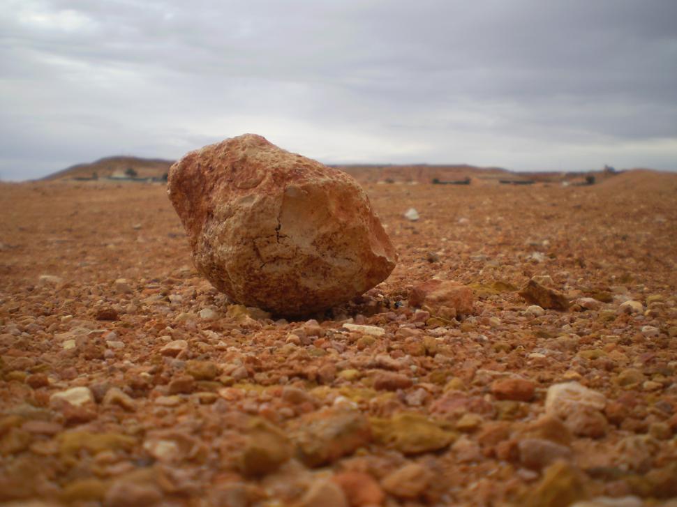 Free Image of Large Rock on Dirt Field 