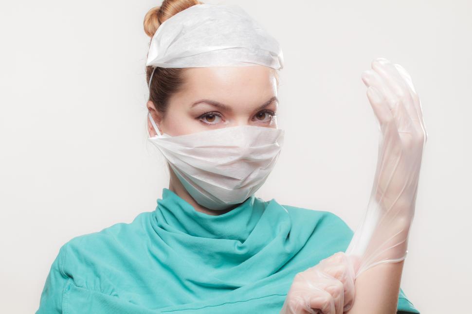 Free Image of A woman wearing a mask and gloves 