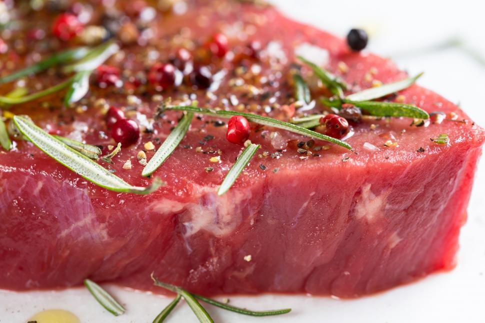 Free Image of A piece of meat with spices and herbs 
