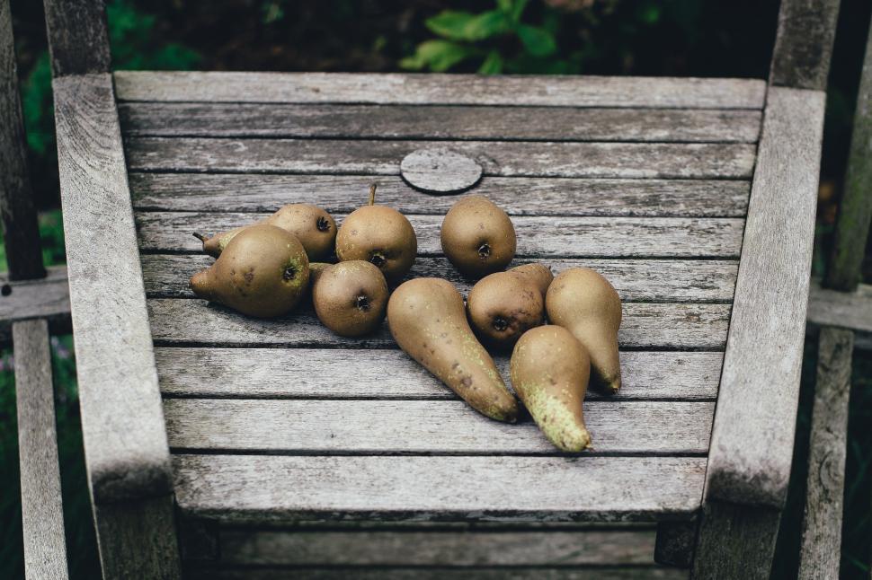 Free Image of A group of pears on a wood table 