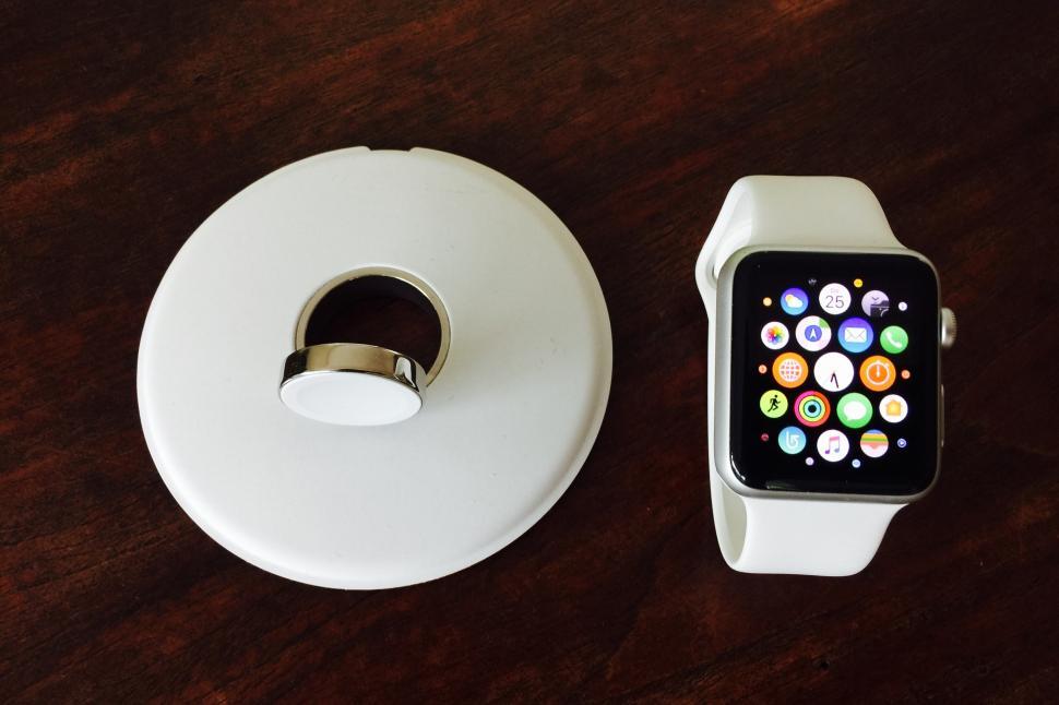 Free Image of A smart watch and a white device 