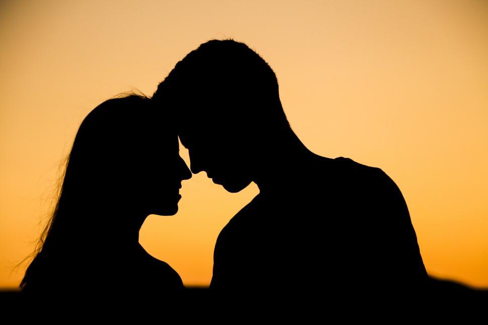 Free Image of A silhouette of a man and woman 