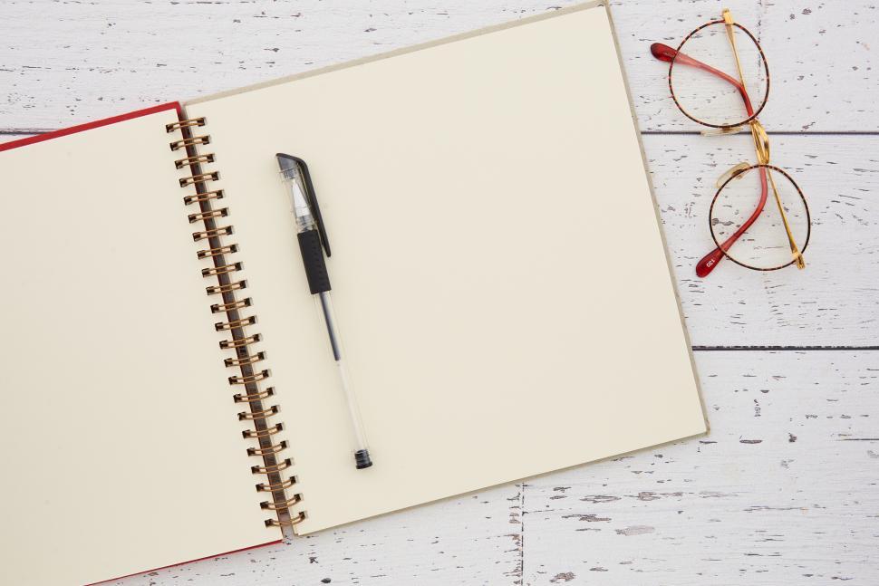 Free Image of A notebook and pen on a table 