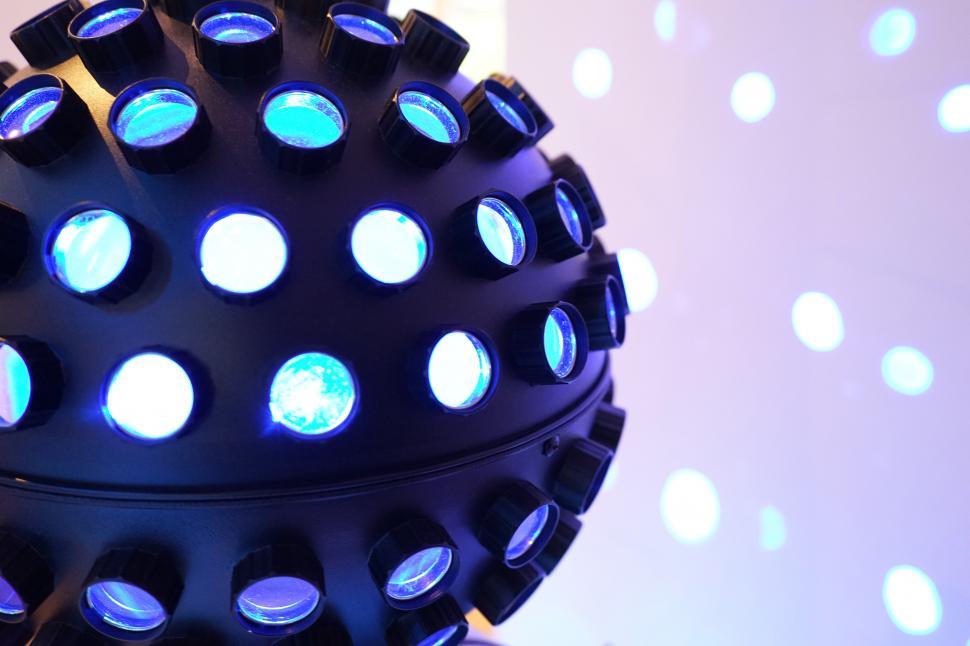 Free Image of A black sphere with blue lights 