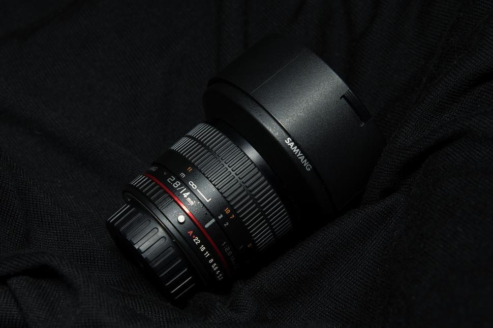 Free Image of A camera lens on a black cloth 