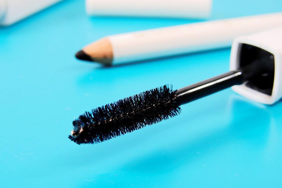 Free Image of A black brush on a blue surface 