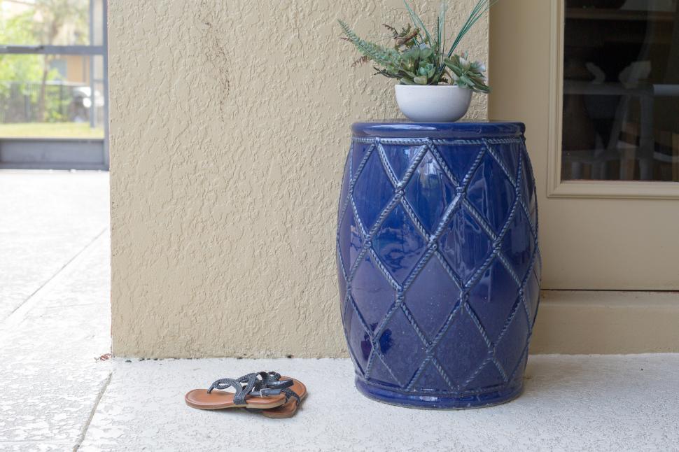 Free Image of A blue ceramic stool with a plant on top 