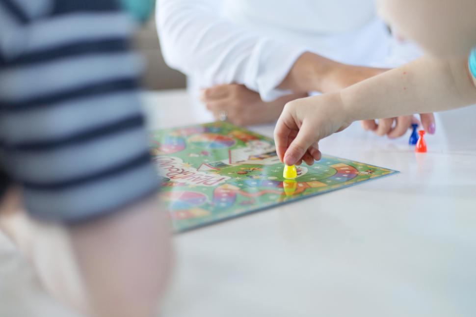 Free Image of A child playing a board game 