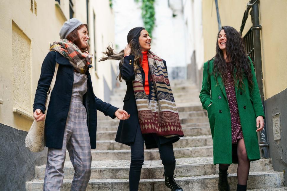 Free Image of Multiethnic group of three happy woman walking together outdoors 