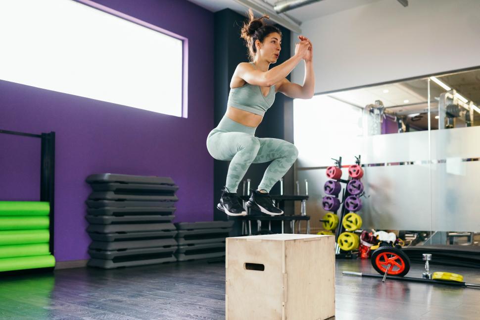 Free Image of Caucasian female doing box jump workout at gym. 